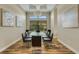 Bright dining room featuring a modern glass table, stylish decor and unique light fixture at 5341 Greenbrook Dr, Sarasota, FL 34238