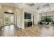 Open dining area with a wine cooler and stylish chandelier at 5341 Greenbrook Dr, Sarasota, FL 34238