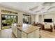 Spacious island with granite counters is the focal point of the kitchen, which adjoins a living area at 5341 Greenbrook Dr, Sarasota, FL 34238