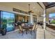 Inviting lanai with outdoor dining, kitchen, and a view of the house interior at 5341 Greenbrook Dr, Sarasota, FL 34238
