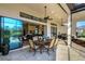 Inviting lanai with outdoor dining, kitchen, and a view of the house interior at 5341 Greenbrook Dr, Sarasota, FL 34238