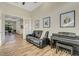 Inviting living room with stylish furniture and access to other rooms at 5341 Greenbrook Dr, Sarasota, FL 34238