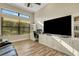 Comfortable office space with built-in shelving and a view of the landscaped outdoors at 5341 Greenbrook Dr, Sarasota, FL 34238
