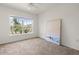 Bright bedroom with a large window offering ample natural light and neutral carpeting at 5711 Soldier Cir # 204, Sarasota, FL 34233