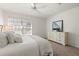 Bright bedroom with a nautical themed painting and window with blinds at 5711 Soldier Cir # 204, Sarasota, FL 34233