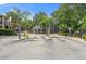 Gated community entrance with lush landscaping and a secure entry system for residents and guests at 5711 Soldier Cir # 204, Sarasota, FL 34233