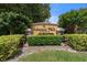 Well-maintained entrance sign for Admirals Walk Condominium surrounded by lush landscaping at 5711 Soldier Cir # 204, Sarasota, FL 34233