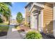 Inviting townhouse entrance with a view of a serene lake and lush landscaping at 5711 Soldier Cir # 204, Sarasota, FL 34233