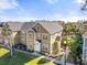 Beautiful townhouse with lush landscaping, manicured lawn, and a welcoming facade at 5711 Soldier Cir # 204, Sarasota, FL 34233