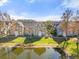 Charming multi-Gathering homes with beautiful landscaping, pond views, and a lovely exterior color scheme at 5711 Soldier Cir # 204, Sarasota, FL 34233