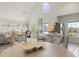 Open floor plan showing dining area leading into living room and kitchen with lots of natural light at 5711 Soldier Cir # 204, Sarasota, FL 34233