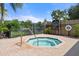 Relaxing community spa with beautiful landscaping and a nearby lake view at 5711 Soldier Cir # 204, Sarasota, FL 34233