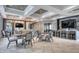 Stylish common area featuring modern furniture, tiled floors, decorative lighting, and multiple seating arrangements at 6428 Devesta Loop, Palmetto, FL 34221