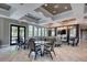Modern lounge features elegant decor, ample seating, and entertainment area with a large tv at 6428 Devesta Loop, Palmetto, FL 34221