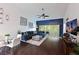 Open-concept living area with modern decor, vaulted ceiling, lots of natural light, and wood-look floors throughout at 6589 Fairway Gardens Dr # 202, Bradenton, FL 34203