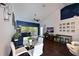 Open-concept living area with modern decor, vaulted ceiling, lots of natural light, and wood-look floors throughout at 6589 Fairway Gardens Dr # 202, Bradenton, FL 34203