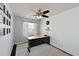 Home office with a ceiling fan, neutral paint, natural light, and dark wood-look floors with geometric area rug at 6589 Fairway Gardens Dr # 202, Bradenton, FL 34203