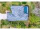 Aerial view of home showcasing roof, landscaping and screened in pool at 6669 Windjammer Pl, Lakewood Ranch, FL 34202