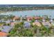 An aerial view of lakeside houses with lush landscaping, showcasing curb appeal and community charm at 6669 Windjammer Pl, Lakewood Ranch, FL 34202