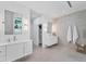 Bright bathroom featuring double sinks and an oversized shower at 6669 Windjammer Pl, Lakewood Ranch, FL 34202