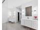Dual vanity bathroom featuring sleek countertops, modern fixtures and tile flooring at 6669 Windjammer Pl, Lakewood Ranch, FL 34202