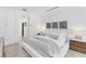 Bright bedroom with white walls, and minimalist decor, offering a clean and modern aesthetic at 6669 Windjammer Pl, Lakewood Ranch, FL 34202
