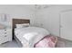 Cozy bedroom with a queen bed, side table, and colorful chandelier at 6669 Windjammer Pl, Lakewood Ranch, FL 34202