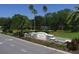 The Edgewater Village entrance features beautiful landscaping, a water feature, and a welcoming sign at 6669 Windjammer Pl, Lakewood Ranch, FL 34202