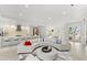 Bright, open-concept living room featuring a gourmet kitchen and dining area at 6669 Windjammer Pl, Lakewood Ranch, FL 34202