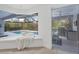 Relaxing pool view from a cozy interior space, blending indoor and outdoor living at 6669 Windjammer Pl, Lakewood Ranch, FL 34202