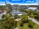Beautifully landscaped home featuring solar panels and a screened-in pool at 121 Holly Ave, Sarasota, FL 34243