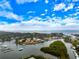 Picturesque aerial view of waterfront neighborhood with docks, boats and coastline views at 121 Holly Ave, Sarasota, FL 34243