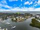 Aerial view pinpointing the property's location within a coastal community, near marinas, and with ocean access at 121 Holly Ave, Sarasota, FL 34243