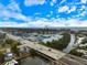 Aerial view showcasing the home's location within a waterfront community, near boating access and a coastal highway at 121 Holly Ave, Sarasota, FL 34243