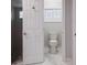 Bathroom featuring a toilet and walk-in shower, offering a serene and functional space at 121 Holly Ave, Sarasota, FL 34243