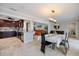 Bright, open-concept dining area featuring elegant lighting and seamless flow to the modern kitchen and inviting living space at 121 Holly Ave, Sarasota, FL 34243