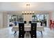 An elegant dining room with a pool view and modern table arrangement at 121 Holly Ave, Sarasota, FL 34243