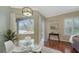 Casual dining area features views of the pool and access to the outdoor space at 12471 Natureview Cir, Bradenton, FL 34212