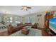 Spacious living room with hardwood floors and views of the pool at 12471 Natureview Cir, Bradenton, FL 34212
