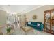 Inviting living room with elegant furnishings, a view of the foyer, and a harmonious color palette, creating a warm atmosphere at 12471 Natureview Cir, Bradenton, FL 34212