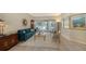 Tastefully decorated living room with stylish furnishings, a cozy rug, and seamless access to the outdoor pool area at 12471 Natureview Cir, Bradenton, FL 34212
