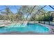Inviting screened-in pool area with a sparkling pool, perfect for relaxing and entertaining in privacy at 12471 Natureview Cir, Bradenton, FL 34212