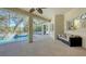 Spacious screened-in pool area with ample seating, providing an ideal space for relaxation and entertainment at 12471 Natureview Cir, Bradenton, FL 34212
