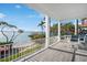 Expansive balcony offering stunning views of the water, palm trees, and a gazebo at 12917 42Nd W Ter, Cortez, FL 34215