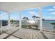 Scenic balcony with white railings, comfortable seating, and panoramic water views at 12917 42Nd W Ter, Cortez, FL 34215