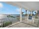 Spacious balcony offers stunning waterfront views with seating area at 12917 42Nd W Ter, Cortez, FL 34215