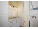 Bright bathroom with white cabinets, granite countertops, and a glass-enclosed shower at 12917 42Nd W Ter, Cortez, FL 34215