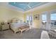 Spacious bedroom with water views, a patterned bedding, and access to a balcony at 12917 42Nd W Ter, Cortez, FL 34215