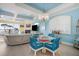 Dining area with seating, blue chairs, and views into the living room and water at 12917 42Nd W Ter, Cortez, FL 34215