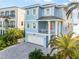 Charming two-story blue home with white shutters and a brick driveway at 12917 42Nd W Ter, Cortez, FL 34215